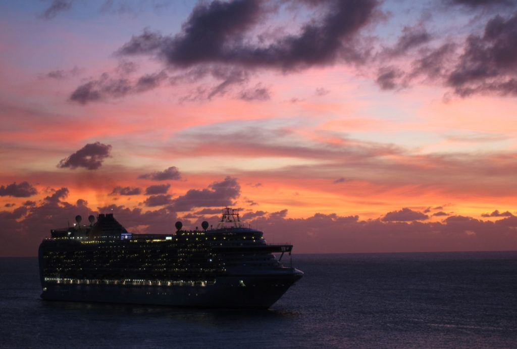 cruise ship at sunset out at sea