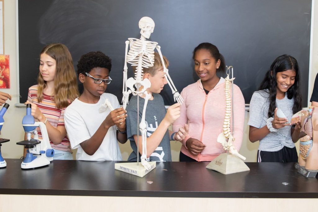 Children in a science classroom learning biology